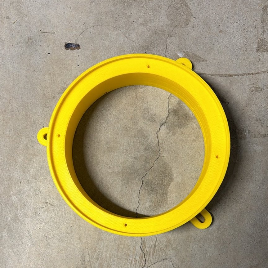 Yellow 3D printed mounting ring with three tabbed mounting points